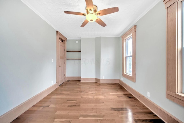 661-663 Beech St, Columbus, OH 43206 - unfurnished bedroom with ornamental molding, light wood finished floors, baseboards, and a ceiling fan