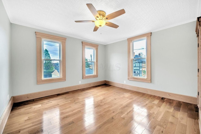 661-663 Beech St, Columbus, OH 43206 - unfurnished room featuring light wood finished floors, ceiling fan, baseboards, and crown molding