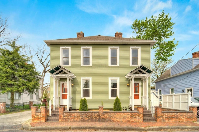 661-663 Beech St, Columbus, OH 43206 - view of front of property featuring fence and a chimney