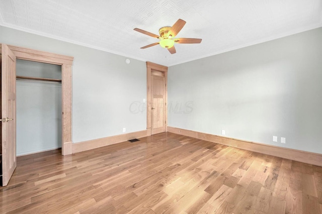661-663 Beech St, Columbus, OH 43206 - unfurnished bedroom featuring wood finished floors, crown molding, baseboards, and a ceiling fan