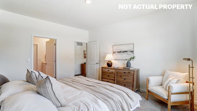 carpeted bedroom with baseboards and visible vents