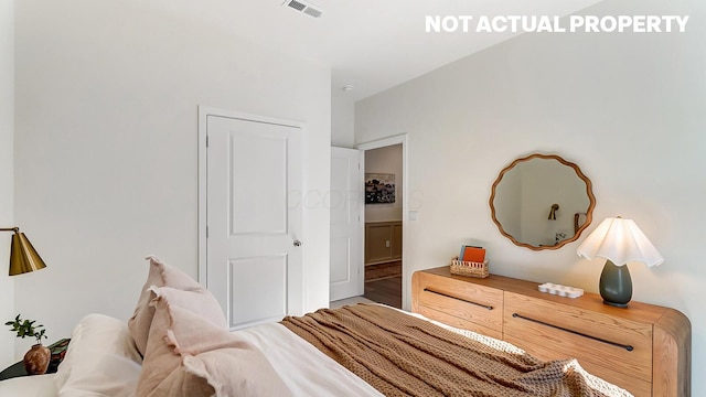 bedroom featuring visible vents