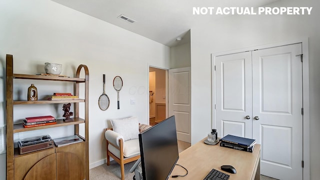 office space featuring baseboards and visible vents