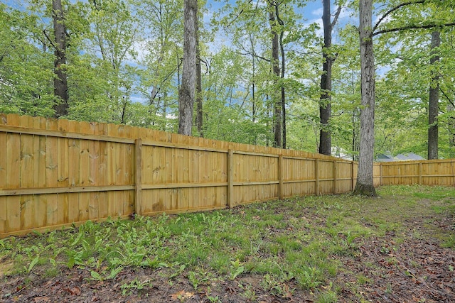 view of yard with a fenced backyard