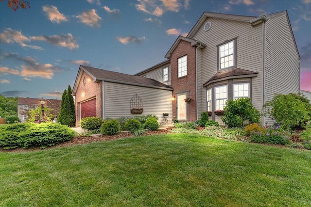 830 Avalon Dr, Pickerington, OH 43147 - traditional-style home featuring a front lawn, an outbuilding, brick siding, and an attached garage