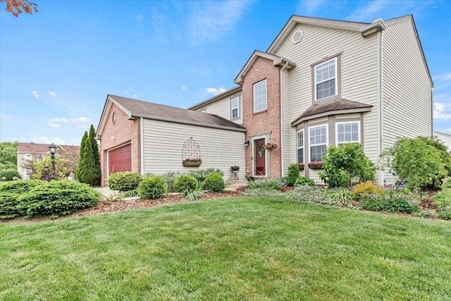 830 Avalon Dr, Pickerington, OH 43147 - traditional home featuring a front yard, an attached garage, and brick siding