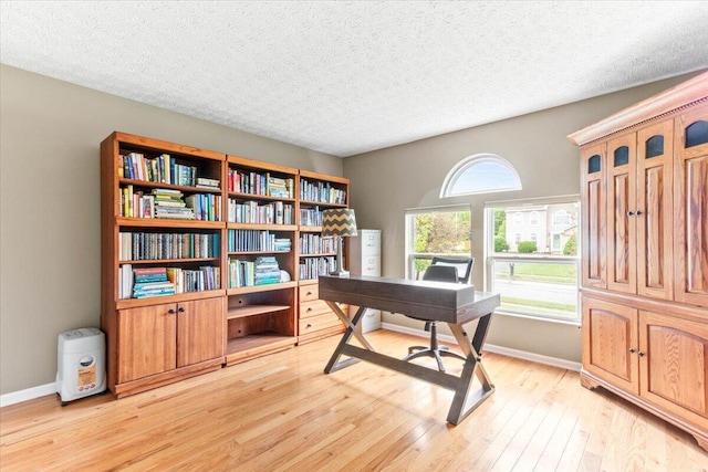 830 Avalon Dr, Pickerington, OH 43147 - office with light wood-style floors, baseboards, and a textured ceiling