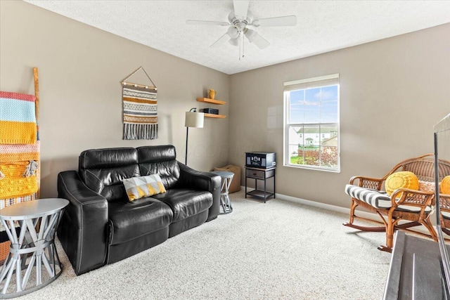 830 Avalon Dr, Pickerington, OH 43147 - living area with carpet flooring, a ceiling fan, a textured ceiling, and baseboards