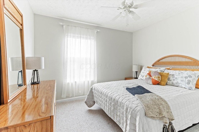 830 Avalon Dr, Pickerington, OH 43147 - carpeted bedroom featuring a textured ceiling, ceiling fan, and baseboards