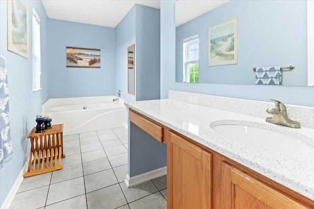 830 Avalon Dr, Pickerington, OH 43147 - full bath featuring vanity, a garden tub, tile patterned floors, and baseboards