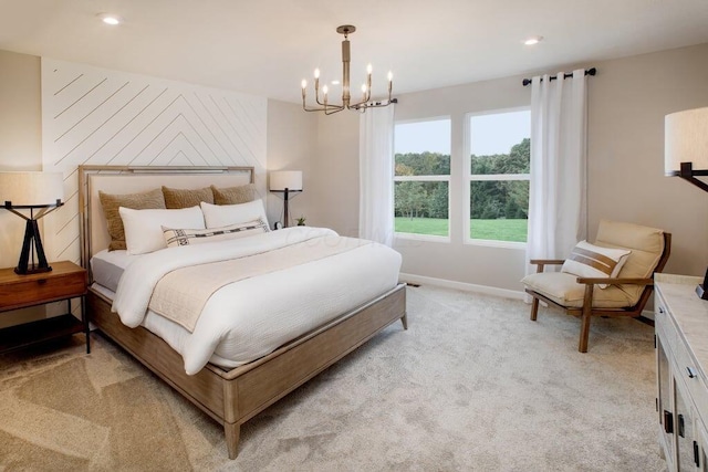 bedroom with light colored carpet, an inviting chandelier, baseboards, and recessed lighting