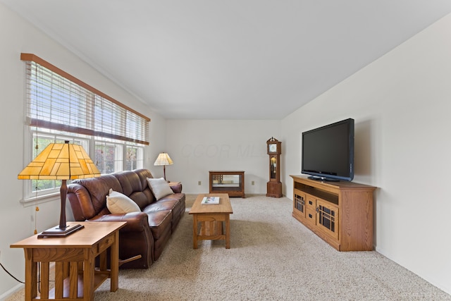carpeted living room with baseboards