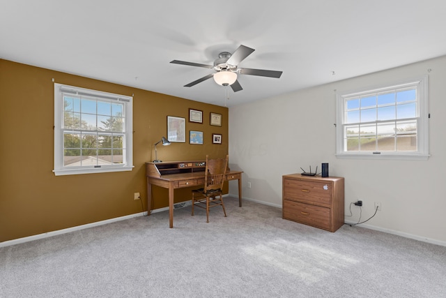 home office with carpet, baseboards, and a ceiling fan