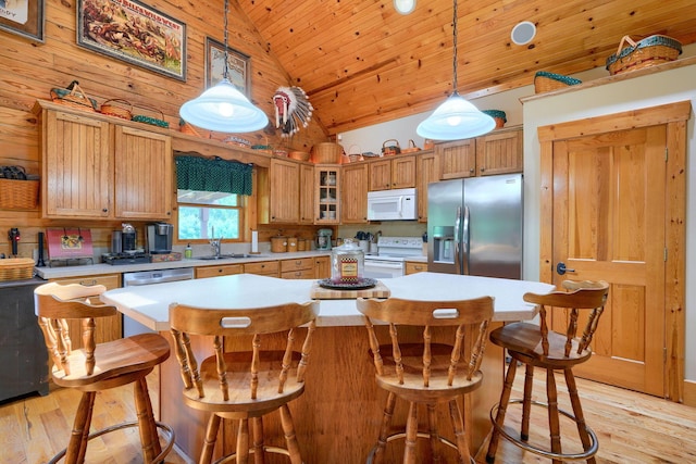 kitchen with wood ceiling, high vaulted ceiling, a sink, white appliances, and light countertops