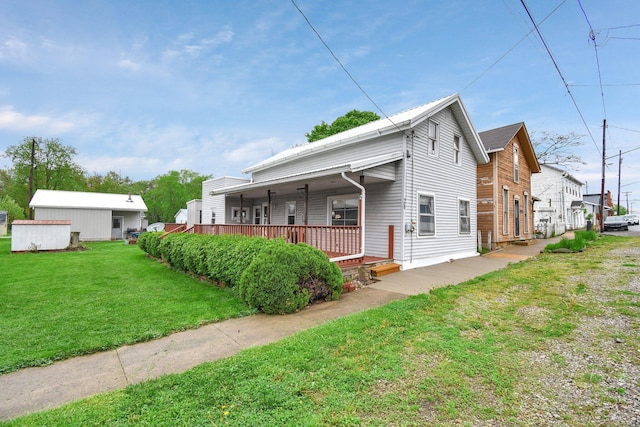 view of front of home with a porch and a front lawn