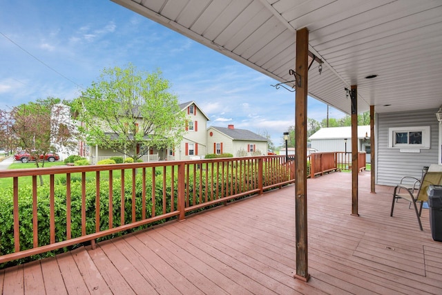 wooden terrace with a residential view