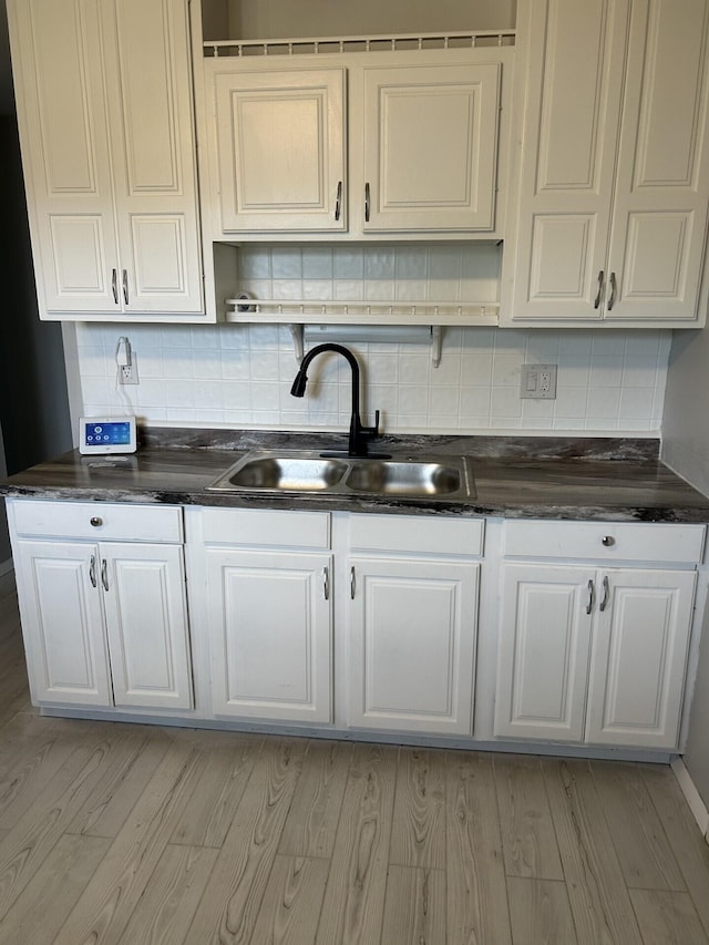 1621 Burley Dr, Columbus, OH 43207 - kitchen featuring a sink, open shelves, tasteful backsplash, and white cabinets
