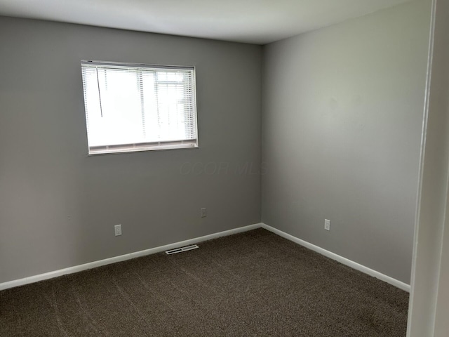 1621 Burley Dr, Columbus, OH 43207 - unfurnished room featuring dark carpet and baseboards