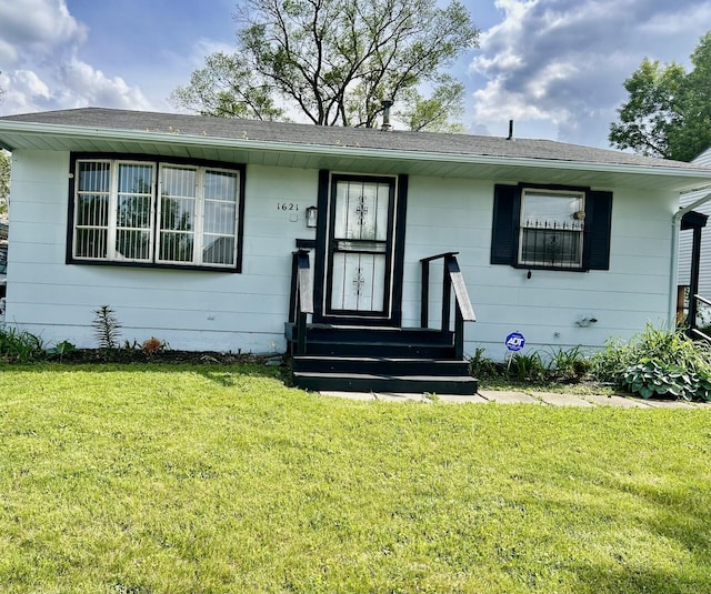1621 Burley Dr, Columbus, OH 43207 - view of front of home with a front lawn and roof with shingles