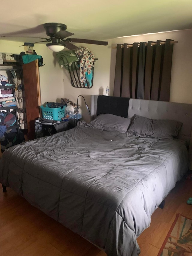 bedroom featuring wood finished floors