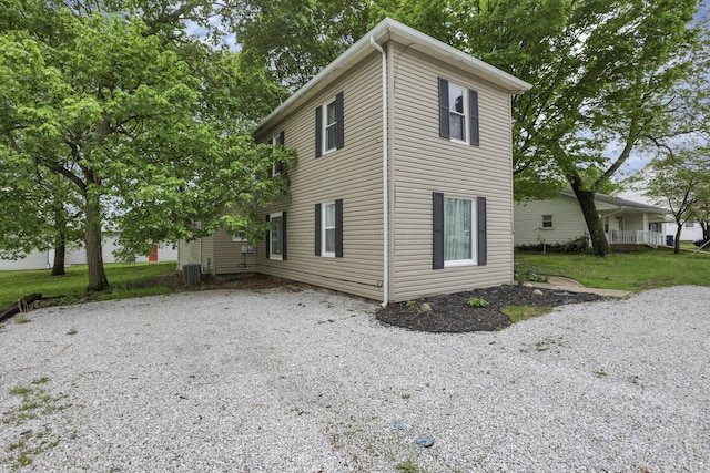 118 Maple St, Hebron, OH 43025 - view of side of property featuring gravel driveway and central air condition unit