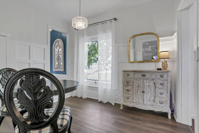 118 Maple St, Hebron, OH 43025 - miscellaneous room featuring a decorative wall, dark wood-type flooring, a chandelier, and wainscoting