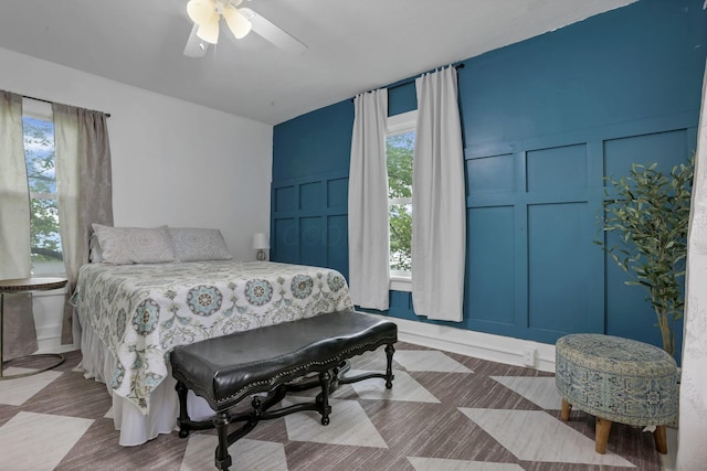 118 Maple St, Hebron, OH 43025 - bedroom featuring a decorative wall, multiple windows, and a ceiling fan