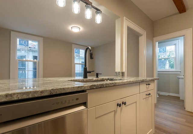 730 Forest Rose Ave, Lancaster, OH 43130 - kitchen with stainless steel dishwasher, a sink, light wood-style flooring, and light stone counters