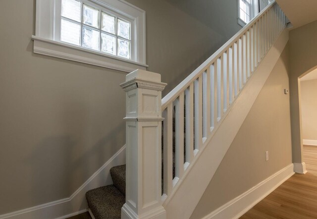 730 Forest Rose Ave, Lancaster, OH 43130 - staircase featuring baseboards, wood finished floors, and arched walkways