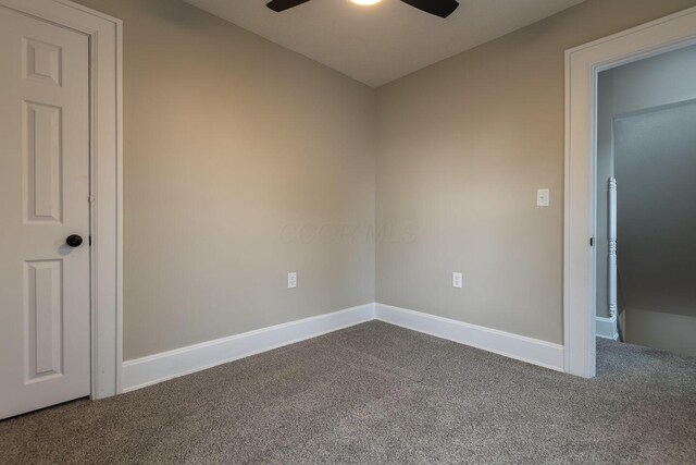 730 Forest Rose Ave, Lancaster, OH 43130 - empty room with dark carpet, ceiling fan, and baseboards