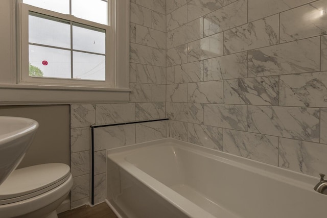 730 Forest Rose Ave, Lancaster, OH 43130 - bathroom featuring a tub, toilet, and a sink
