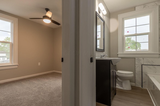 730 Forest Rose Ave, Lancaster, OH 43130 - full bathroom with toilet, a bath, vanity, ceiling fan, and baseboards
