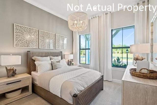 bedroom featuring baseboards, light carpet, and an inviting chandelier