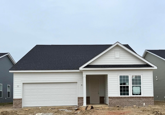 1830 Zucchina Dr Lot 204, Hilliard, OH 43026 - view of front facade featuring brick siding, a shingled roof, and a garage