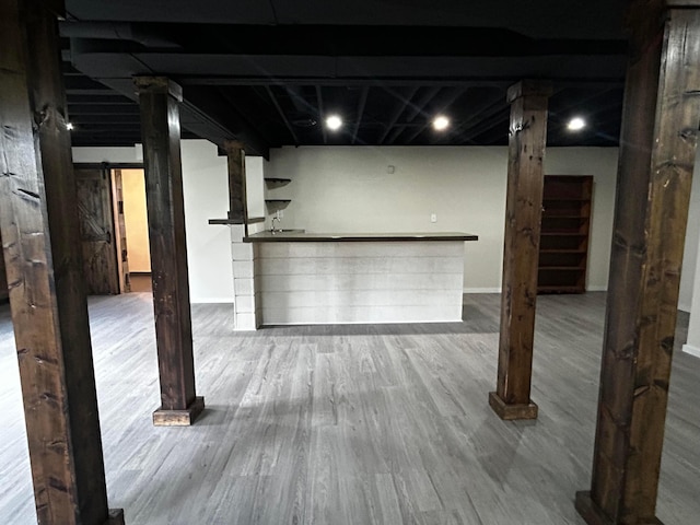 12601 Vincent Rd, Mount Vernon, OH 43050 - finished below grade area with wood finished floors, a bar, and baseboards