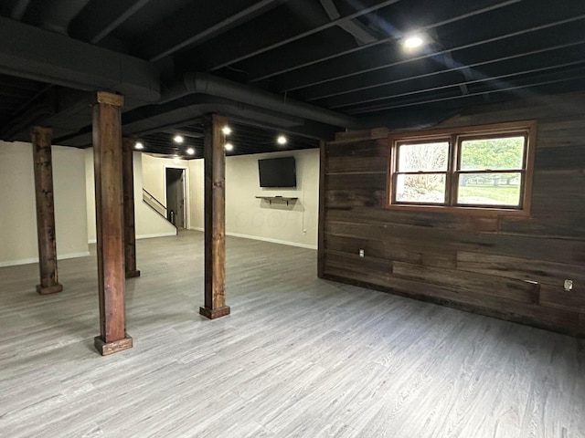 12601 Vincent Rd, Mount Vernon, OH 43050 - basement featuring stairway, wood walls, and wood finished floors