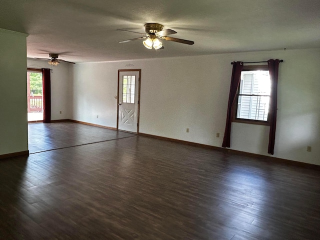 12601 Vincent Rd, Mount Vernon, OH 43050 - spare room featuring ceiling fan, dark wood-type flooring, and baseboards