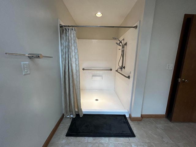 12601 Vincent Rd, Mount Vernon, OH 43050 - full bathroom with a stall shower, baseboards, and tile patterned floors