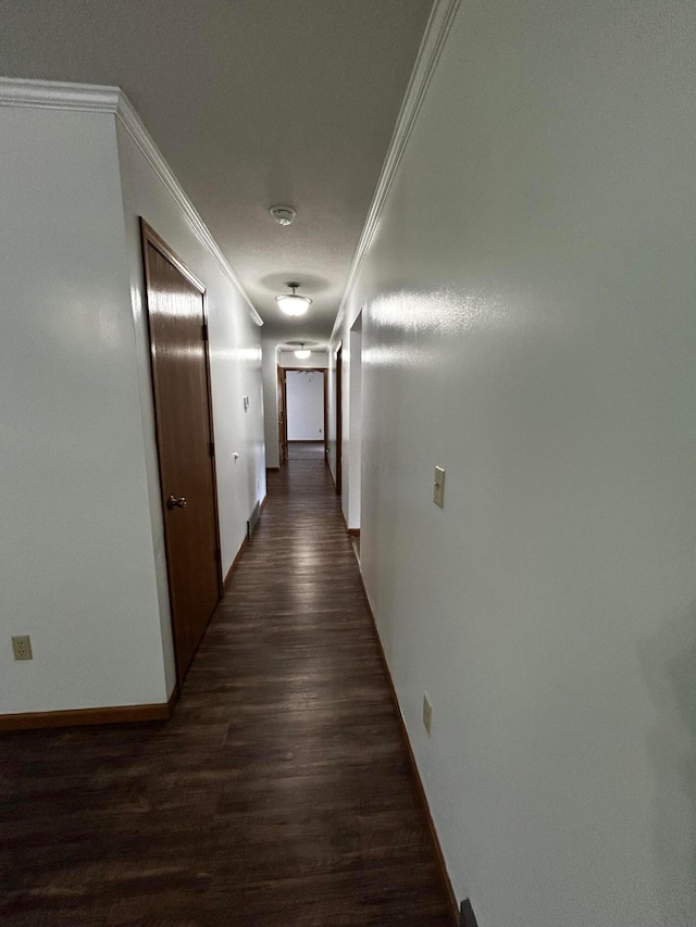 12601 Vincent Rd, Mount Vernon, OH 43050 - corridor with crown molding, dark wood finished floors, baseboards, and arched walkways