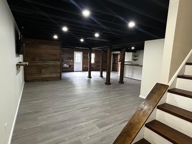 12601 Vincent Rd, Mount Vernon, OH 43050 - basement with stairs, wood finished floors, wood walls, and baseboards