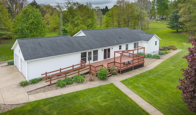 12601 Vincent Rd, Mount Vernon, OH 43050 - back of house featuring a wooden deck, roof with shingles, a yard, and concrete driveway
