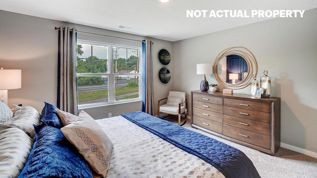 bedroom with carpet, baseboards, and visible vents