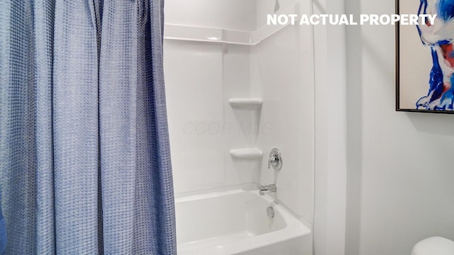 bathroom with shower / bath combination with curtain