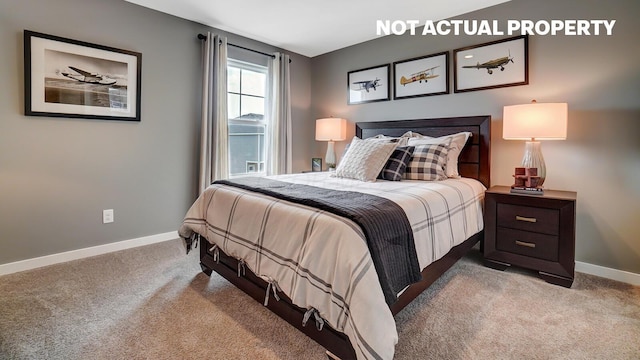 bedroom with carpet floors and baseboards