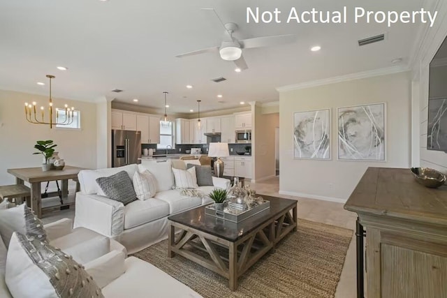 living room featuring visible vents, ceiling fan with notable chandelier, ornamental molding, and recessed lighting