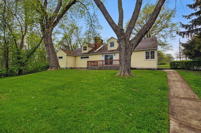 1899 S Main St, Mansfield, OH 44904 - view of front of home with a chimney, a front yard, a wooden deck, and a shingled roof