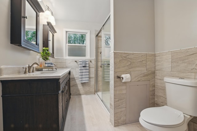 1899 S Main St, Mansfield, OH 44904 - full bath featuring toilet, tile walls, and a wealth of natural light