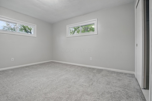 1899 S Main St, Mansfield, OH 44904 - unfurnished room with baseboards, a wealth of natural light, and carpet flooring