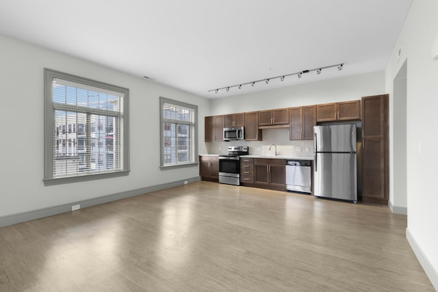 51 N High St Unit 408, Columbus, OH 43215 - kitchen with stainless steel appliances, a sink, light countertops, and light wood-style flooring