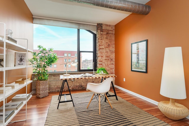 home office with wood finished floors and baseboards